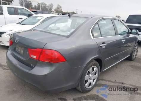 2009 Kia Optima Lx z USA, uszkodzony, nr VIN KNAGE228X95333611